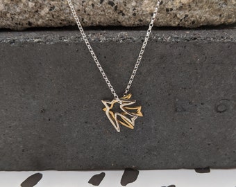 Two Little Birds Necklace: Sterling Silver and Gold Swallow Charm Necklace from Lily McCallin's Take Flight Collection.