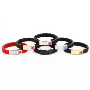 May include: Five braided leather bracelets with a medical symbol charm. The bracelets are in black, red, and black with a silver, gold, and black metal plate.