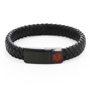 May include: Black leather braided bracelet with a black metal clasp and a red medical symbol.