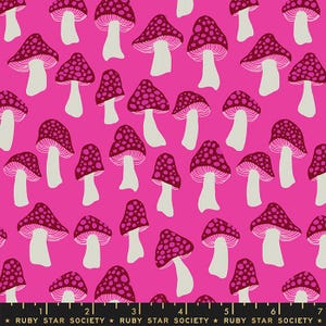 May include: A vibrant pink fabric featuring a repeating pattern of burgundy mushrooms with white stems. The mushroom caps are dotted with lighter pink spots. The text "RUBY STAR SOCIETY" is at the bottom.