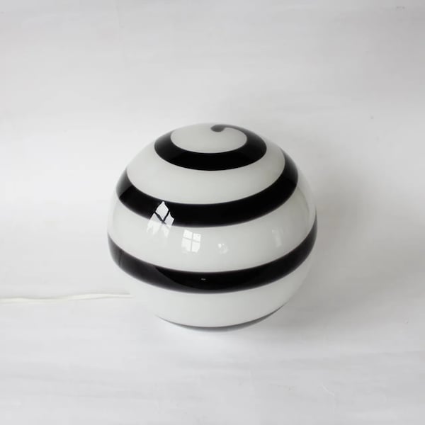 Floor glass lamp with a swirl Design from the German brand Wofi Leuchten