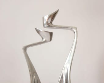 Swan candle stick, designed by Matthew Hilton in 1983