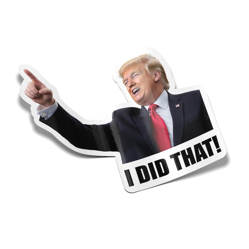 May include: A sticker featuring a smiling man in a suit and red tie, pointing with his left index finger. The text "I DID THAT!" is in bold, black letters.