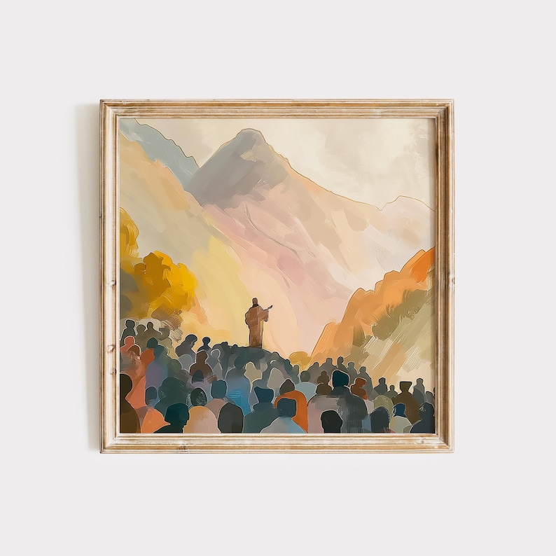 May include: A framed watercolor painting depicts a crowd of people gathered before a figure on a raised platform. The background features mountains in shades of orange, purple, and yellow. The painting has a warm, inviting color palette and a soft, artistic style, suitable for home decor.