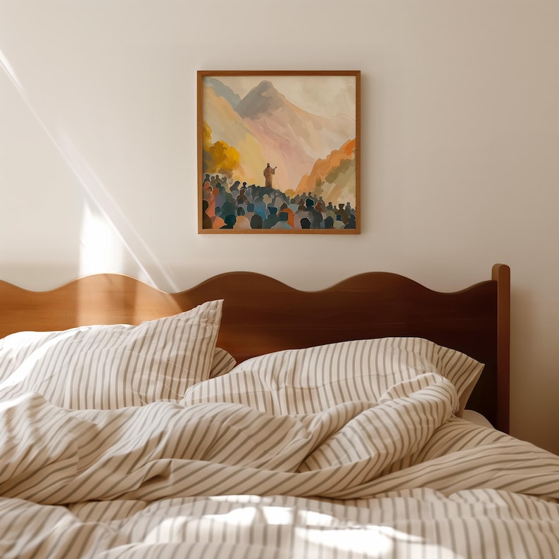 May include: A framed watercolour painting shows a figure addressing a crowd against a mountain backdrop. The artwork uses warm orange, yellow, and blue tones. The painting hangs above a bed with striped bedding.