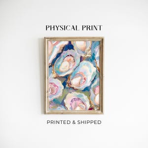 May include: A framed art print featuring an abstract painting of oysters in shades of blue, pink, and white. The artwork has a textured appearance and is labeled "PHYSICAL PRINT" and "PRINTED & SHIPPED".