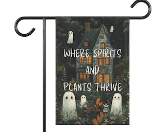 May include: A Halloween-themed garden flag with a dark green, brown, and white color scheme. It features a spooky house with glowing windows and the text "Where Spirits and Plants Thrive" with white ghosts flying around the house.