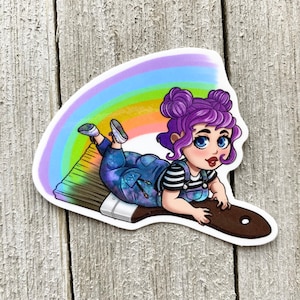 May include: A cartoon illustration of a girl with purple hair and a rainbow behind her, riding on a paintbrush.