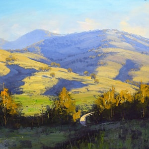 May include: A painting of a winding road leading through a valley with rolling hills and a blue sky. The hills are covered in green grass and trees. The road is surrounded by trees and bushes.
