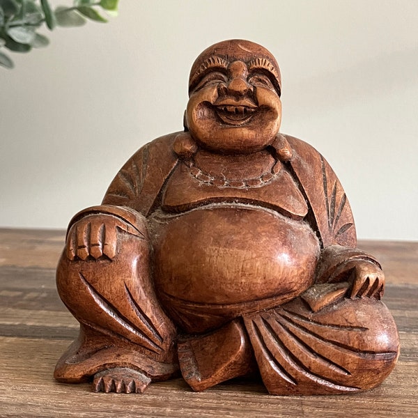 Figura di Buddha felice in legno intagliato
