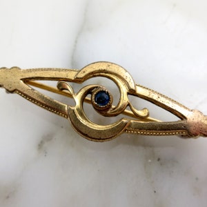 Jugendstil Brosche - goldfarben, saphirblauer Strassstein, antik