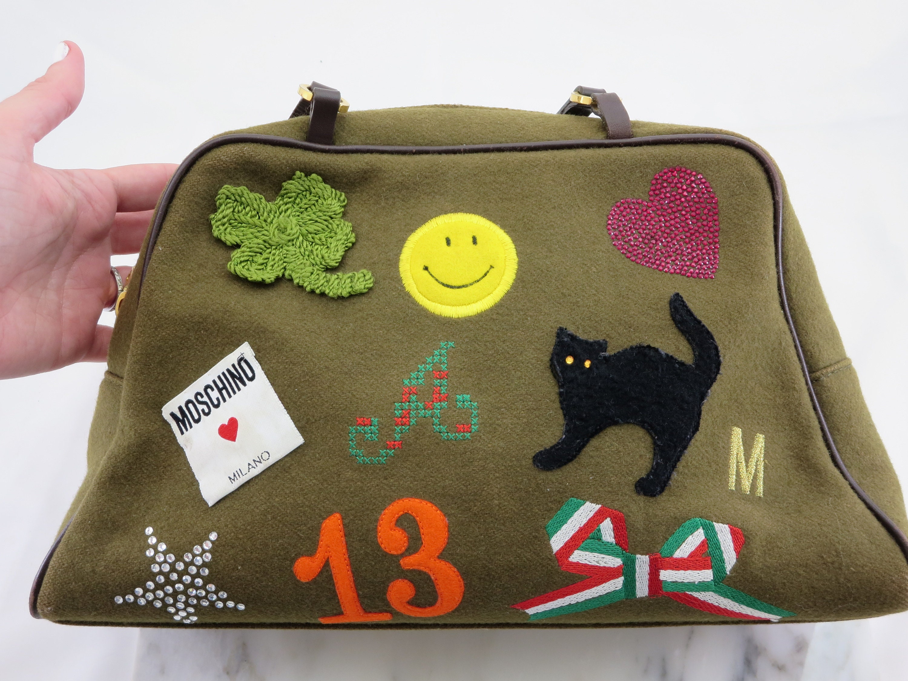 Vintage Moschino black leather shoulder bag with golden cute