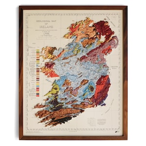 May include: A vintage geological map of Ireland, framed in wood. The map shows the different rock formations in Ireland, with a key to the right of the map. The map is titled "Geological Map of Ireland" and is dated 1961.