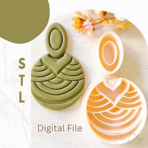 May include: An olive green earring cutter with a geometric fan pattern and a matching white plastic 3D printed cutter frame. The text STL Digital File is visible on the left side of the image, indicating a downloadable file for crafting.