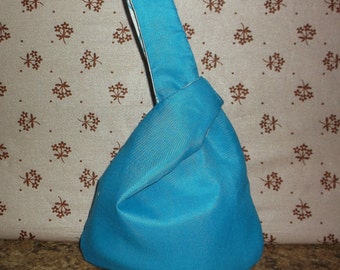 japanese knot bag small turquoise wristlet