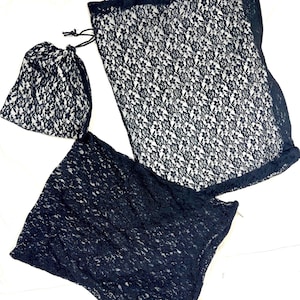 Trío de bolsos de encaje negro