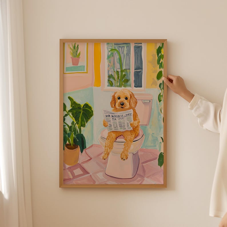 a woman standing next to a painting of a golden doodle dog on a toilet