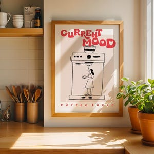 a picture of a kitchen with a picture of a woman cooking