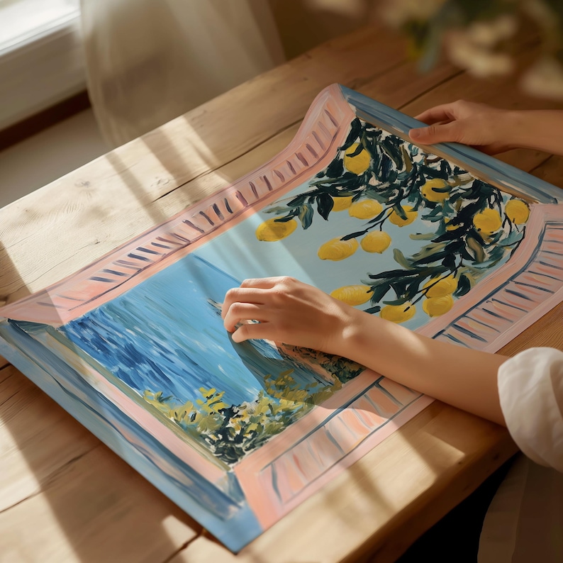 a person is painting a picture on a table