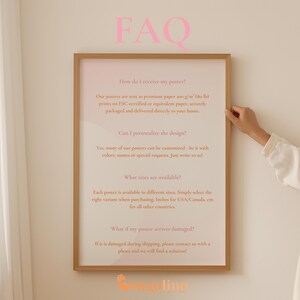 a person holding up a framed poster with the words faq on it