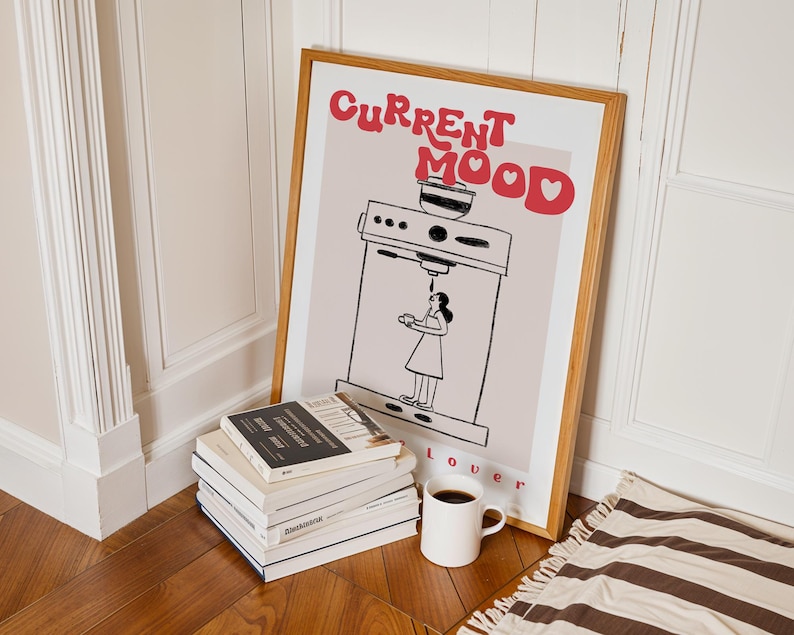 a pile of books sitting next to a poster