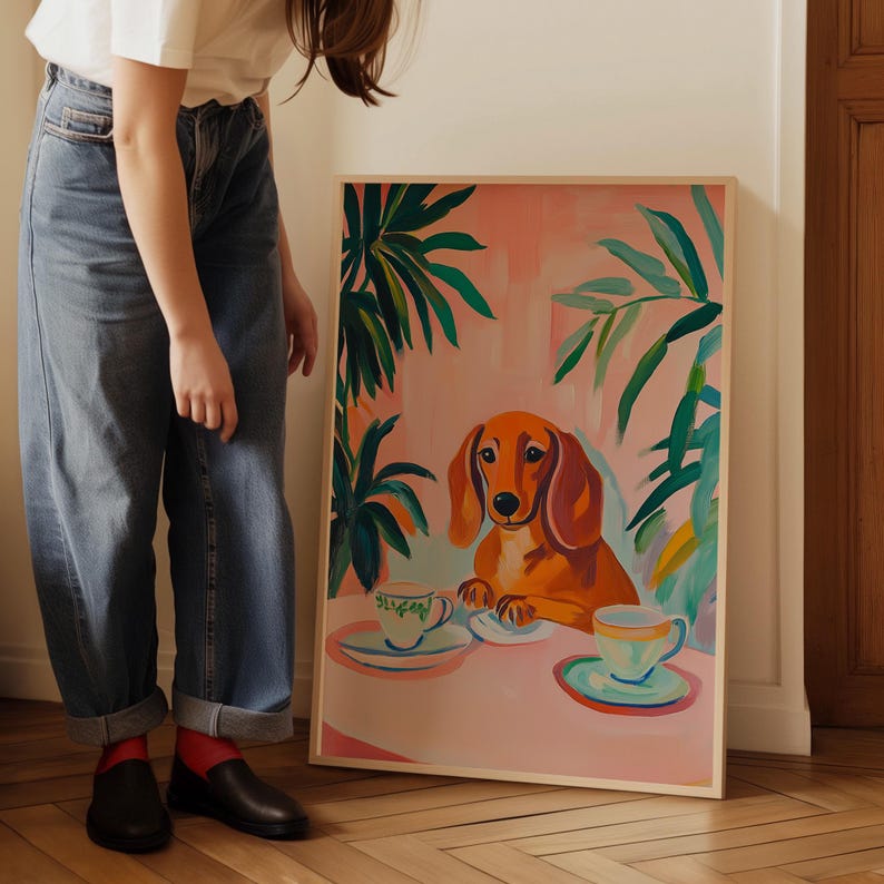 a woman standing next to a painting of a dog
