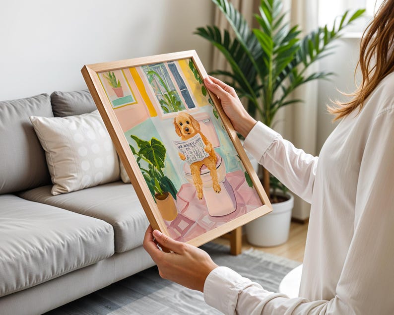 a woman holding a picture of a dog in a living room