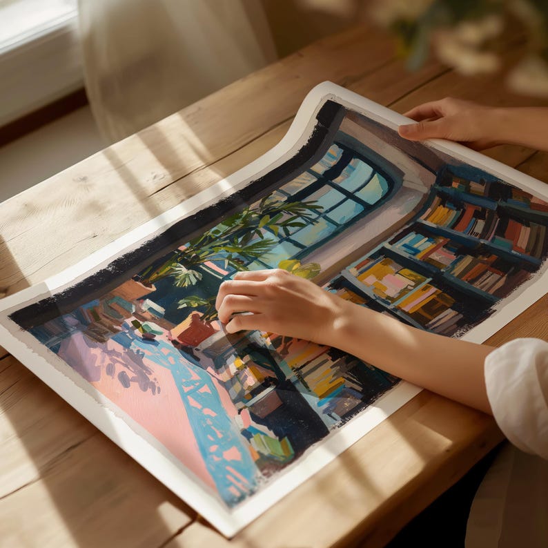 a person is painting a picture on a table