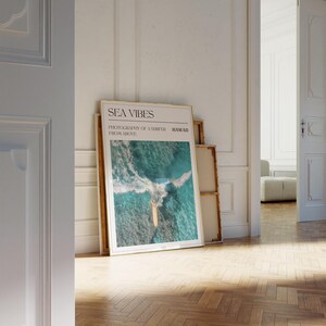 a picture of the ocean waves on display in a room