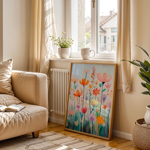 a living room with a couch and a painting on the wall