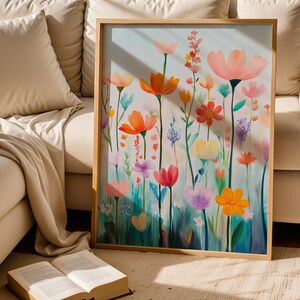 a painting of flowers on a canvas next to an open book