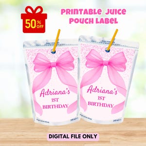 May include: Two juice pouch labels with pink bows and the text "Adriana's 1st Birthday." Each pouch has a yellow straw and a capacity of 200 ml. The image also includes a red gift box with "50% OFF" and the text "PRINTABLE JUICE POUCH LABEL" and "DIGITAL FILE ONLY."