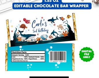 May include: Editable chocolate bar wrapper template featuring an underwater scene with a whale, sea turtles, and starfish. The text "Carlos' 3rd birthday" is printed on the wrapper. The wrapper is 1.55 ounces.