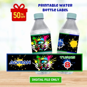 May include: Printable water bottle labels with a paintball theme. The labels feature a black background with colorful paint splatters, a paintball mask, and the text "Adrian" and "Turns 8".
