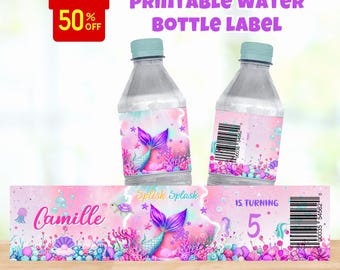 May include: Two water bottles with mermaid-themed labels. The labels feature a mermaid tail, the name "Camille", and the number "5". The text "Printable Water Bottle Label" is at the top. A banner at the bottom reads "Digital File Only".
