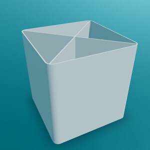 May include: A white, square-shaped desk organizer with four compartments. The organizer is made of plastic and has a smooth, matte finish.