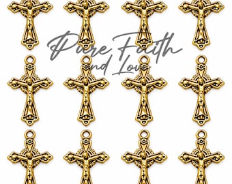 May include: Twelve gold-toned metal crucifix charms arranged in a grid, each featuring a detailed figure of Jesus and a circular halo design. The text Pure Faith and Love is centered in a cursive script font behind the charms.