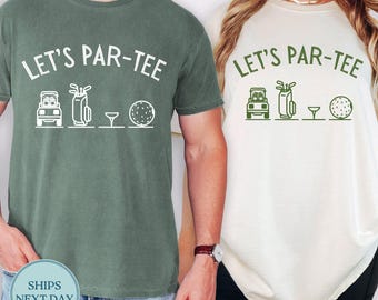 May include: Two t-shirts, one green and one cream, each with the text "LET'S PAR-TEE" above golf-themed graphics. The graphics include a golf cart, golf bag, tee, and golf ball. The green shirt has white graphics, while the cream shirt has green graphics.