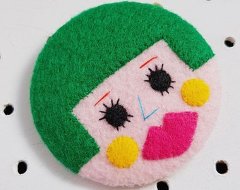 green haired girl badge