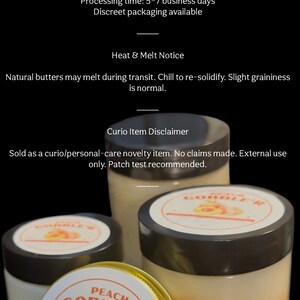 May include: Three jars of Peach Gobble'r balm with black lids and gold rims. The labels feature peach illustrations and the text "Peach Gobble'r". The jars are filled with a creamy, peach-colored balm. Sizes available: 1 oz tin, 2 oz jar, and 4 oz jar.