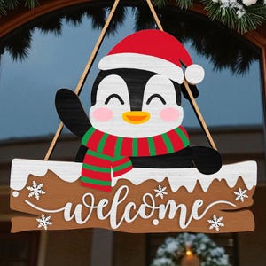 Christmas Penguin Welcome Door Hanger | Cute Winter Holiday Sign for Front Door | Wooden Snowy Porch Decor | Penguin in Santa Hat