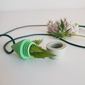 Secret storage capsule - small, green hidden container necklace for stash, medicines, herbs, seeds - bio-based material - adjustable cord