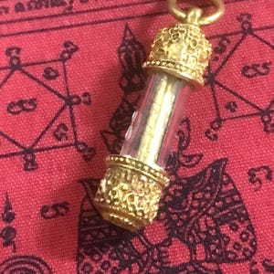 Sarika Takrut Thai amulet by Kru Ba Noi Wat Sri Don Moon Chiang Mai Thailand Authentic Thai amulets  Prominent in terms of great charm.