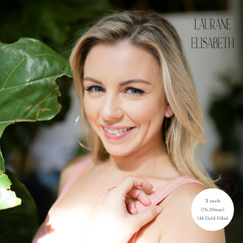 model wearing 3 inch 14k gold filled thin hoop earrings.  threader earrings. Laurane Elisabeth specializing in delicate, lightweight handmade, minimalist earring designs available in 14k gold filled, 14k rose gold filled and 925 sterling silver. nickel free threader earrings.