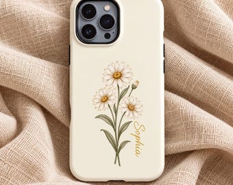 May include: A cream-colored smartphone case featuring a printed illustration of three white daisy flowers with green stems and leaves. The name Sophia is printed in a gold cursive script font to the right of the floral design.