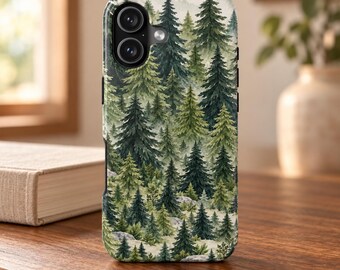May include: A smartphone case featuring a dense forest pattern with various shades of green pine trees and small gray rocks. The design covers the entire back of the case, which has a dual-lens camera cutout in the upper left corner.