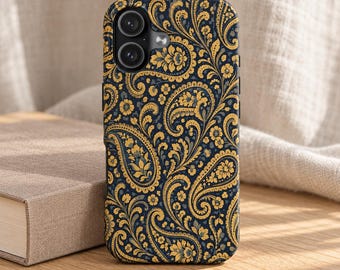 May include: A smartphone case featuring a dark navy blue background with an intricate, repeating golden yellow paisley and floral pattern. The case has cutouts for a dual-lens camera system and a flash, maintaining a slim, rectangular profile.