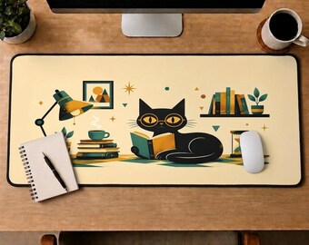 May include: A rectangular desk mat with a cream-colored background featuring a black cat wearing glasses and reading an open book. The illustration includes a desk lamp, a stack of books with a coffee cup, a shelf with books, and a potted plant.