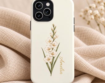 May include: A cream-colored smartphone case featuring a vertical illustration of a white gladiolus flower with green stems and leaves. The name Amelia is printed in a gold cursive script to the right of the floral design.