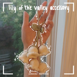 May include: Crochet pattern for a lily of the valley accessory. The accessory is made of white and green yarn and features a cluster of lily of the valley flowers.